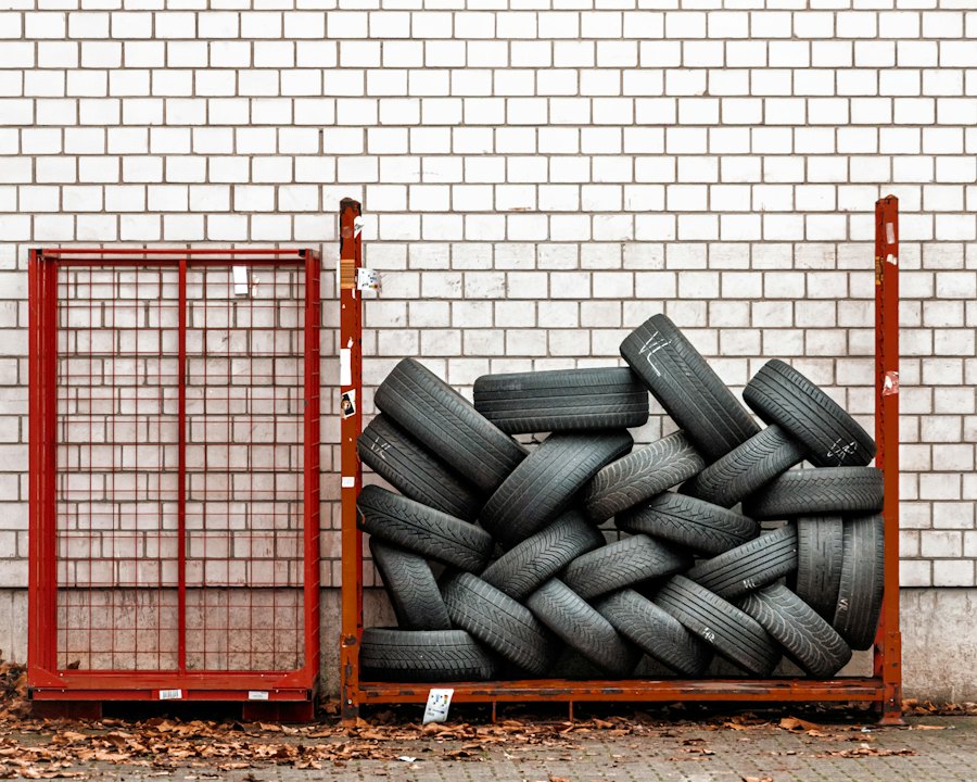 Tires stacked in a red metal storage rack